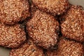 Close-up oatmeal biscuits with sesame seeds on a gray background