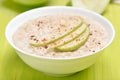 Oatmeal porridge with apple slices and cinnamon Royalty Free Stock Photo