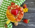 Oatmeal porridge, apricot, strawberry, nutrition breakfast heart on a wooden background Royalty Free Stock Photo