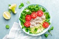 Oatmeal porridge with avocado and vegetable salad of fresh tomatoes and lettuce. Healthy dietary breakfast