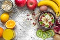 Oatmeal porridge with banana, kiwi fruit, pomegranate, cinnamon and nuts Royalty Free Stock Photo