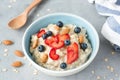 Oatmeal porridge bowl with berries and nuts Royalty Free Stock Photo