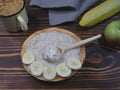 Oatmeal porridge with butter and banana in a plate, natural oatmeal drink made from cereals and fruit, apple Royalty Free Stock Photo