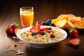 Oatmeal porridge with fresh berries and orange juice on wooden table, Chia seed pudding with strawberries, blueberries and banana Royalty Free Stock Photo