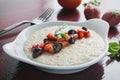 Oatmeal porridge with fruits and greens, hot and healthy food for Breakfast Royalty Free Stock Photo