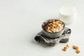 Oatmeal porridge with nuts, chocolate in a gray bowl, a glass of milk. Breakfast, healthy food.Copy space. Good morning Royalty Free Stock Photo