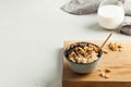 Oatmeal porridge with nuts, chocolate in a gray bowl, a glass of milk. Breakfast, healthy food.Copy space. Good morning Royalty Free Stock Photo