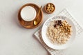 Oatmeal porridge on a plate that says good morning and a cup of milk. Healthy food. Breakfast. Copy space Royalty Free Stock Photo