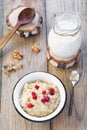 Oatmeal porridge with raspberry and milk, healthy breakfast Royalty Free Stock Photo