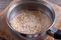 Oatmeal porridge in a saucepan Royalty Free Stock Photo