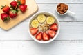 Oatmeal Porridge with Strawberries, Almonds and Banana in white bowl. Healthy Breakfast with Oatmeal and Fresh Organic Strawberry Royalty Free Stock Photo