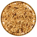 Oatmeal, raisins, cashews and almonds. Granola in round plate
