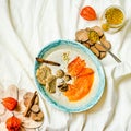 Oatmeal smoothies bowl with persimmons, raw sweets, superfoods,