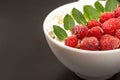 Oatmeal with strawberries, whipped cream and mint leaves, close-up Royalty Free Stock Photo