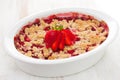 Oatmeal strawberry crumble in white dish Royalty Free Stock Photo