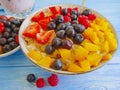 Oatmeal, strawberry,gourmet peach a wooden background