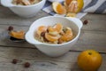 Oatmeal with tangerine and walnuts.