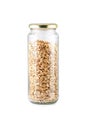 Oats in glass jar isolated on white background. Jar filled with Rolled Oats. Royalty Free Stock Photo