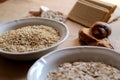 Oats and rice in a bowl. Rice cakes and bread in background. Foods high in carbohydrate. Royalty Free Stock Photo