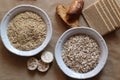 Oats and rice in a bowl. Rice cakes and bread in background. Foods high in carbohydrate. Royalty Free Stock Photo