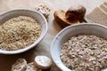 Oats and rice in a bowl. Rice cakes and bread in background. Foods high in carbohydrate. Royalty Free Stock Photo
