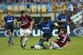 Obafemi Martins , Paolo Maldini and Kakhaber Kaladze in action during the match