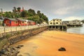 Oban, Stewart Island, New Zealand. The pier and Church Hill Royalty Free Stock Photo