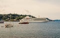 Oban, United Kingdom - February 20, 2010: water crafts in sea along mountain coast. Cruise ship and sailing boats in sea