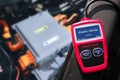 OBD-II Scanner displaying electric vehicle data scanning process , Car code reader scan tool