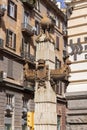 Obelisc with ancient ship hull in front of renaissance Palazzo della Borsa, Naples, Italy