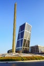 Obelisk in the center of Plaza Castilla and modern office buildings of inclined construction, Madrid.