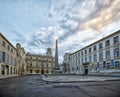 Obelisk and Church of St. Trophime on Place de la Republique in Arles, France