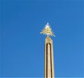 obelisk with the eye of providence in golden metal above it