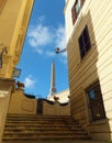 Obelisk in front of Trinita dei Monti church in Rome, Italy, viewed from a narrow flight of steps off it