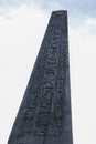 The Obelisk of Luxor on the Place de la Concorde in sunny day. Famous sight of Paris. Luxor obelisk close up and hieroglyphics on