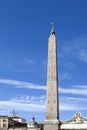 Obelisk in Piazza del Popolo, Rome. An Egyptian obelisk stands in the centre of the Piazza. Three sides of the obelisk were carved