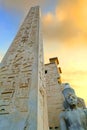 Obelix and statue of Ramses II at the first pylon of the Luxor Temple.