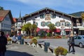 OBERAMMERGAU, GERMANY - OKTOBER 09, 2018: Tourists in a city street with medieval houses and paintings on the walls