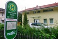 Oberbayern Public Transit ski bus stop sign with street name Mittenwalder Strasse. Garmisch-Partenkirchen, Bavaria, Germany