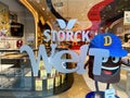 View on display window of store with logo lettering of storck welt sweets company in shopping mall