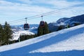 OBERSTAUFEN, GERMANY - 31 DEC, 2017: Ski lift with gondola cable car and ski slope in the foreground