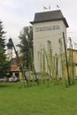 Hop grows on poles in front of a beer brewery building. Austria.