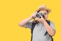 Obese boy traveler taking a picture with a vintage camera Royalty Free Stock Photo