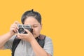 Obese boy traveler taking a picture with a vintage camera Royalty Free Stock Photo