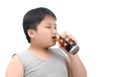 Obese fat boy drinking cola isolated on white