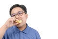 Obese fat boy eating potato chips isolated on white background Royalty Free Stock Photo