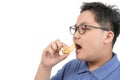 Obese fat boy eating potato chips isolated on white background, junk food concept Royalty Free Stock Photo