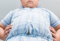 Obese fat boy overweight. Tight shirt of pajamas Royalty Free Stock Photo