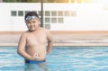 Obese fat boy in swimming pool, concept healthy and exercise