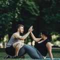 Obese girl giving high five to fitness instructor Royalty Free Stock Photo